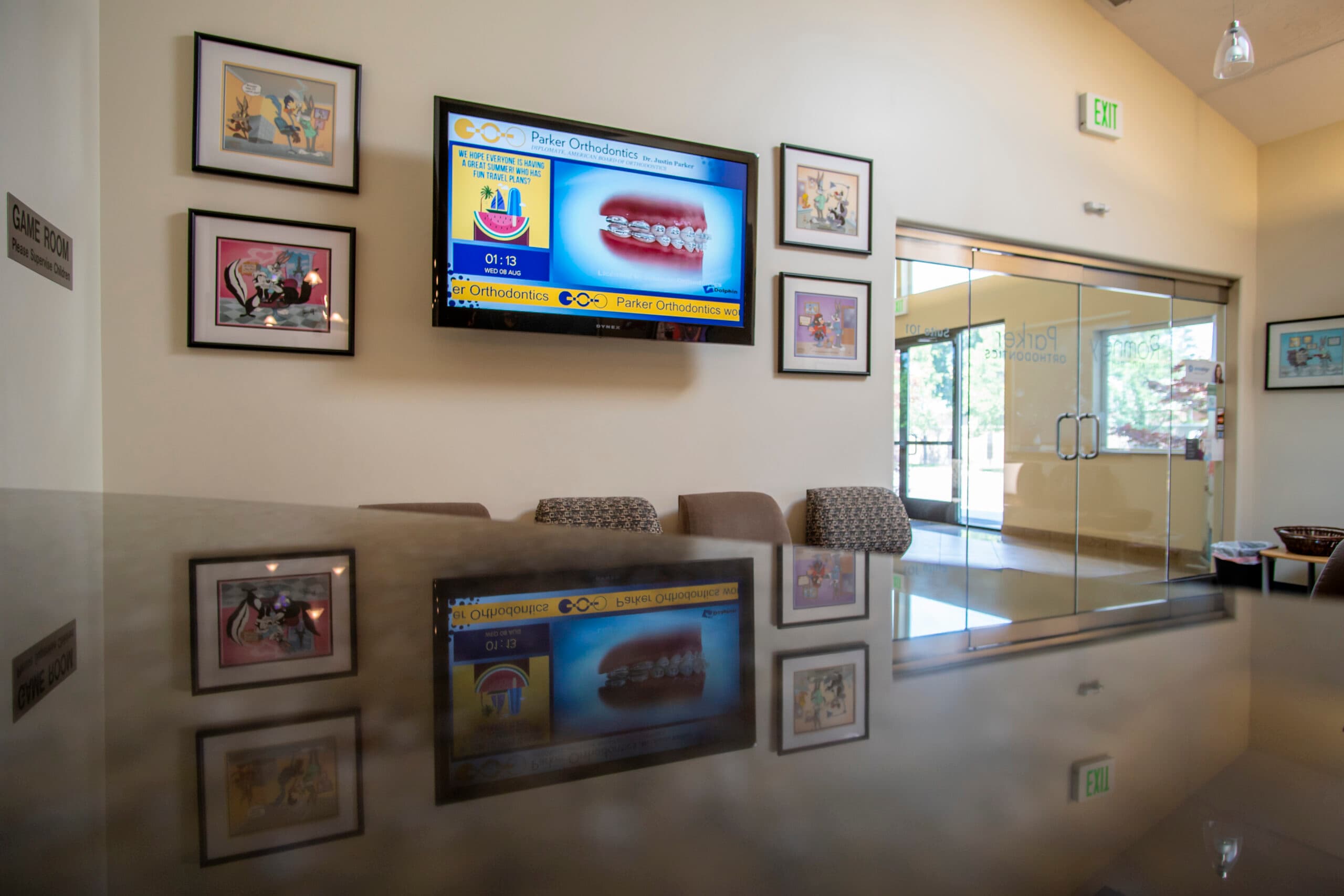Dental office waiting room with digital display content