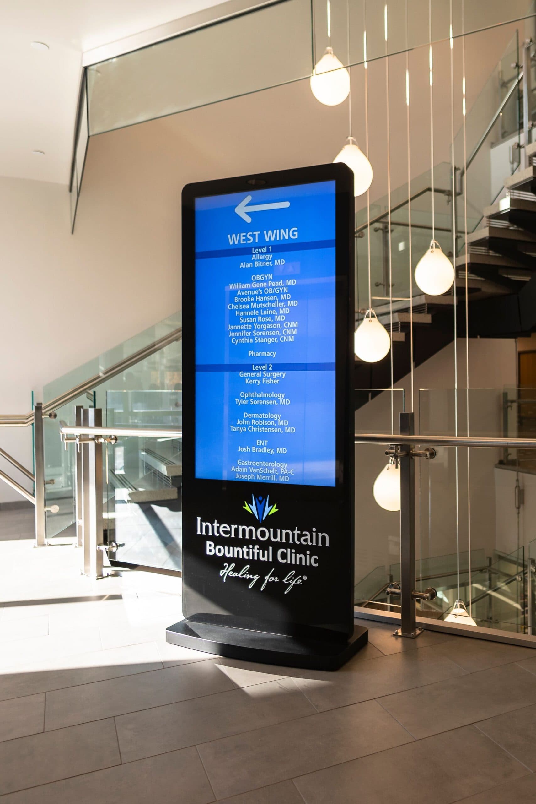 Healthcare facility display wall for patient communication